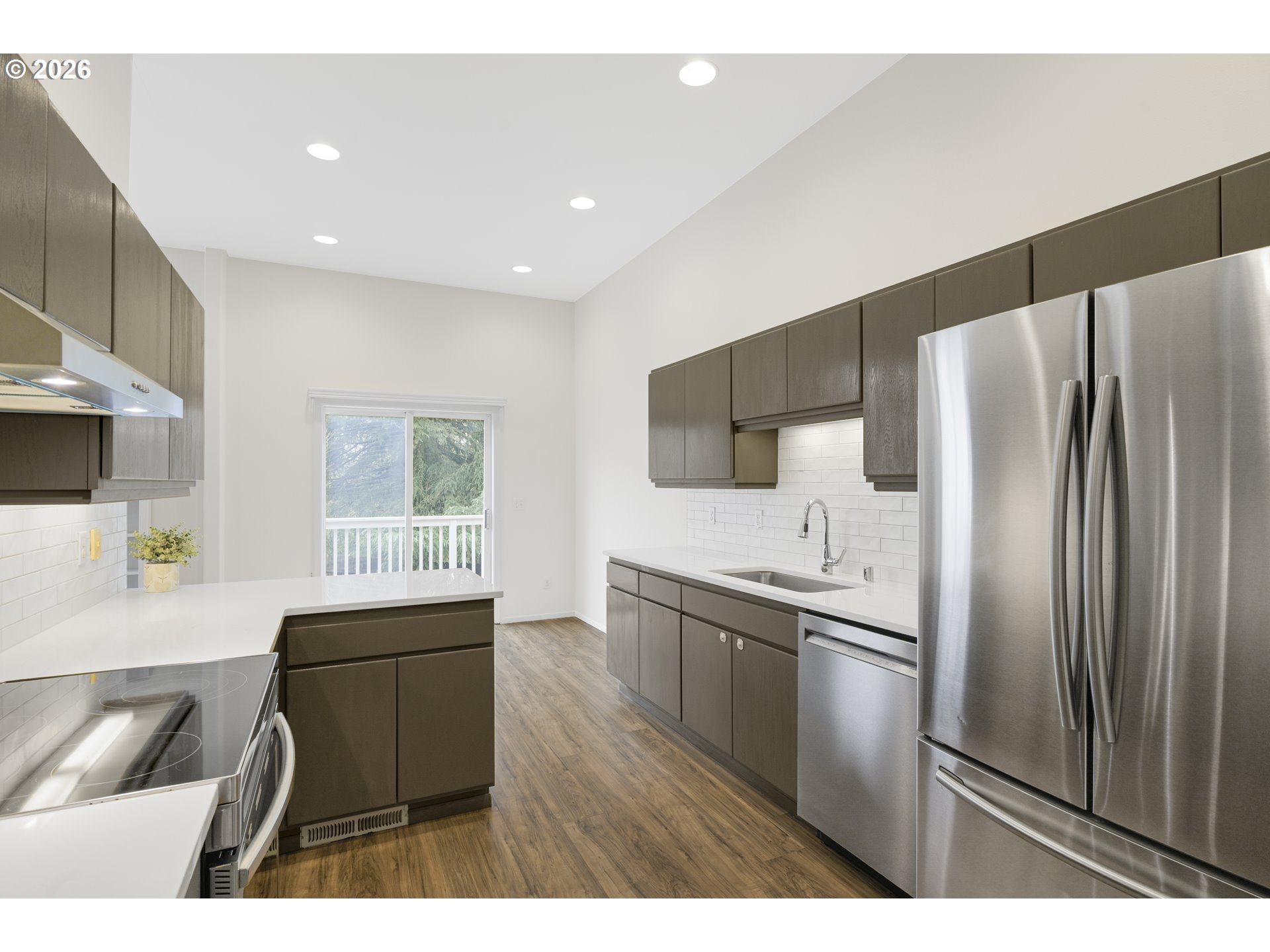 2415 Northwest Norwood Place Camas, WA 98607 - Photo 13 of 36 a kitchen with stainless steel appliances a refrigerator sink and microwave