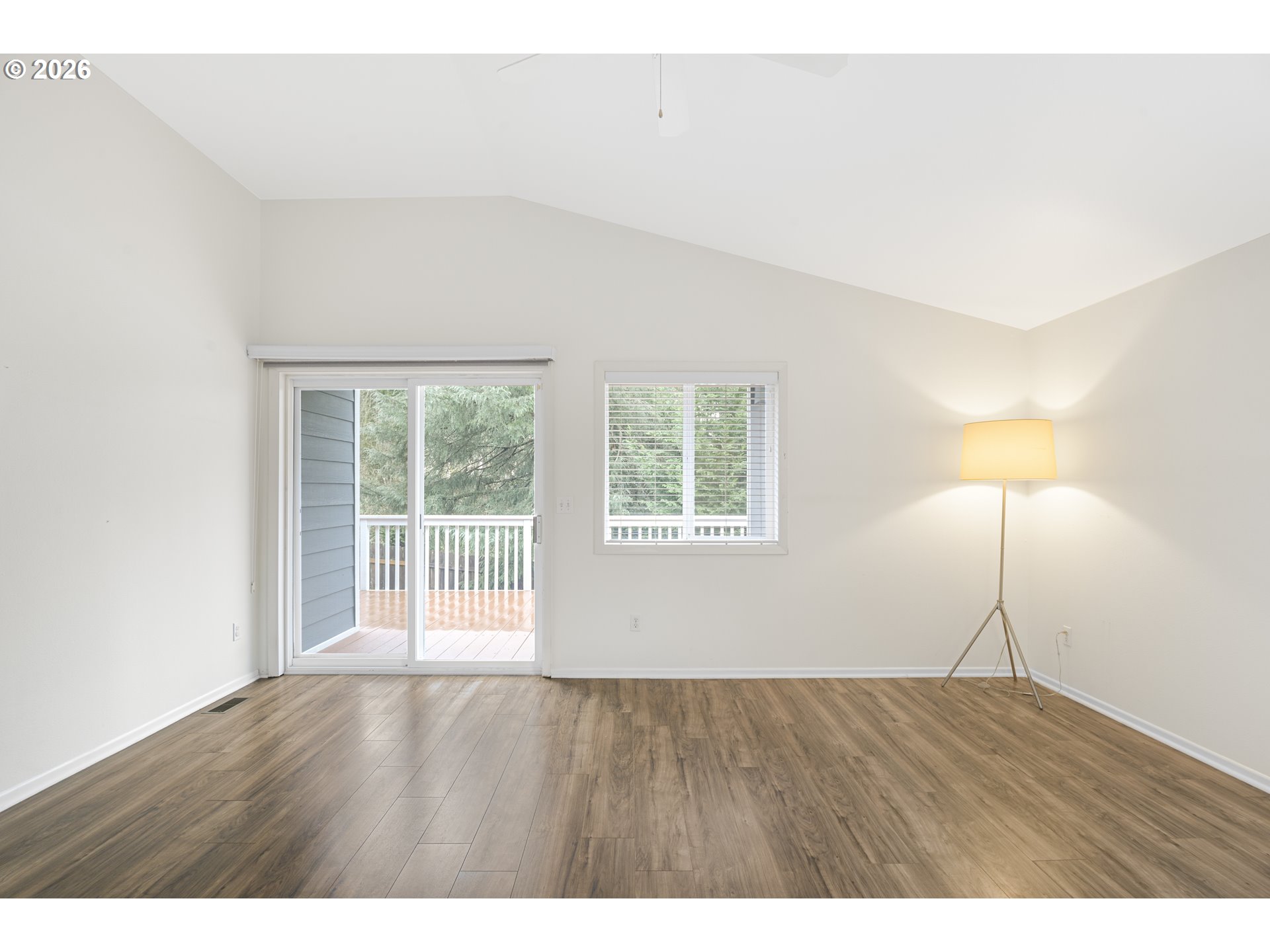 2415 Northwest Norwood Place Camas, WA 98607 - Photo 16 of 36 a view of an empty room with wooden floor and a window