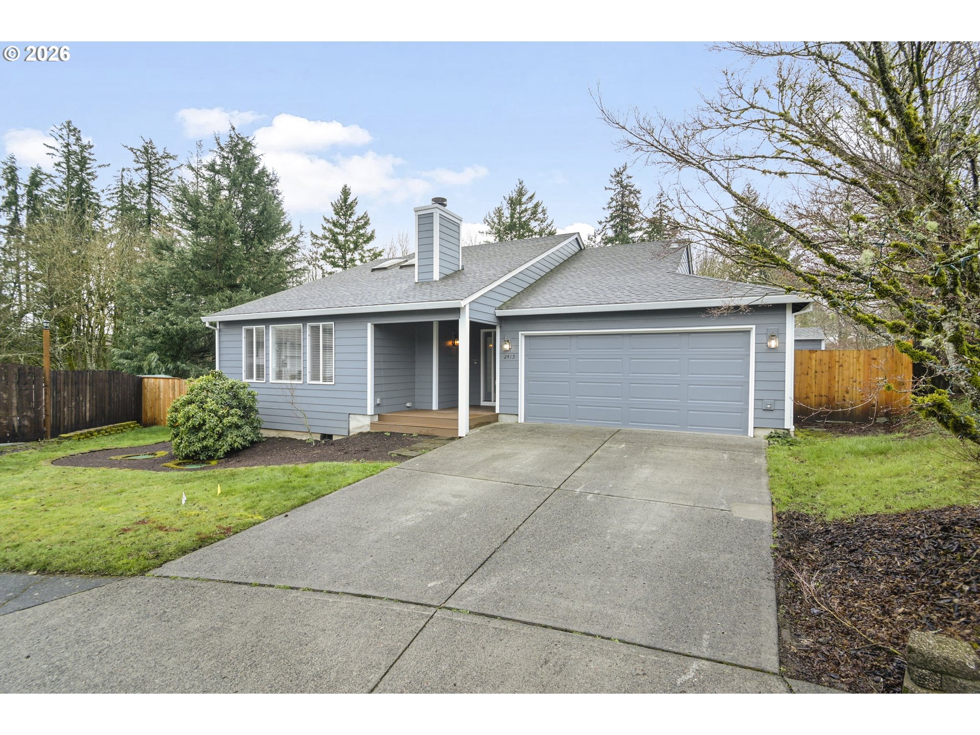 2415 Northwest Norwood Place Camas, WA 98607 - Photo 2 of 36 a front view of a house with a yard and garage