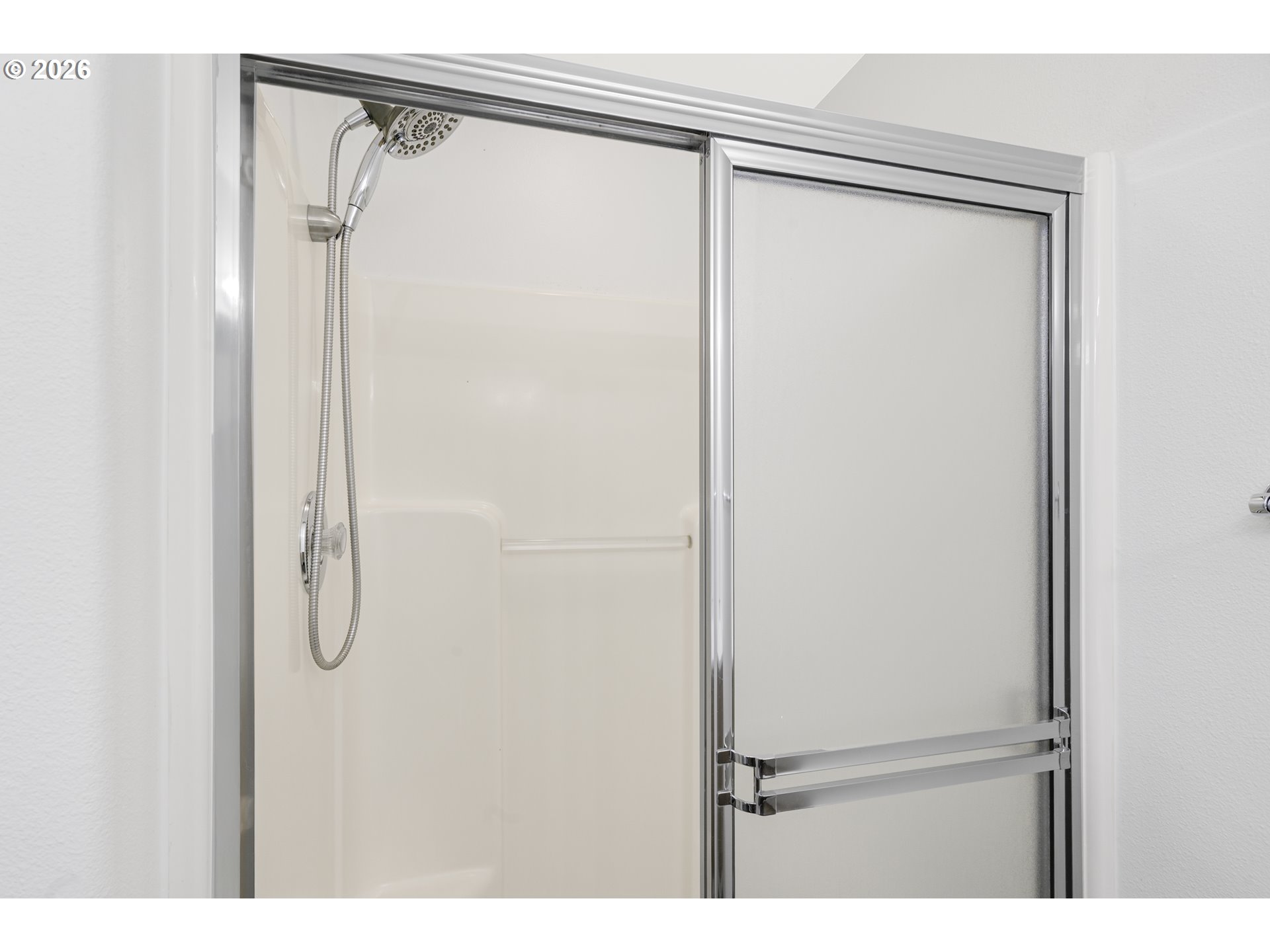 2415 Northwest Norwood Place Camas, WA 98607 - Photo 22 of 36 a bathroom with a glass shower door