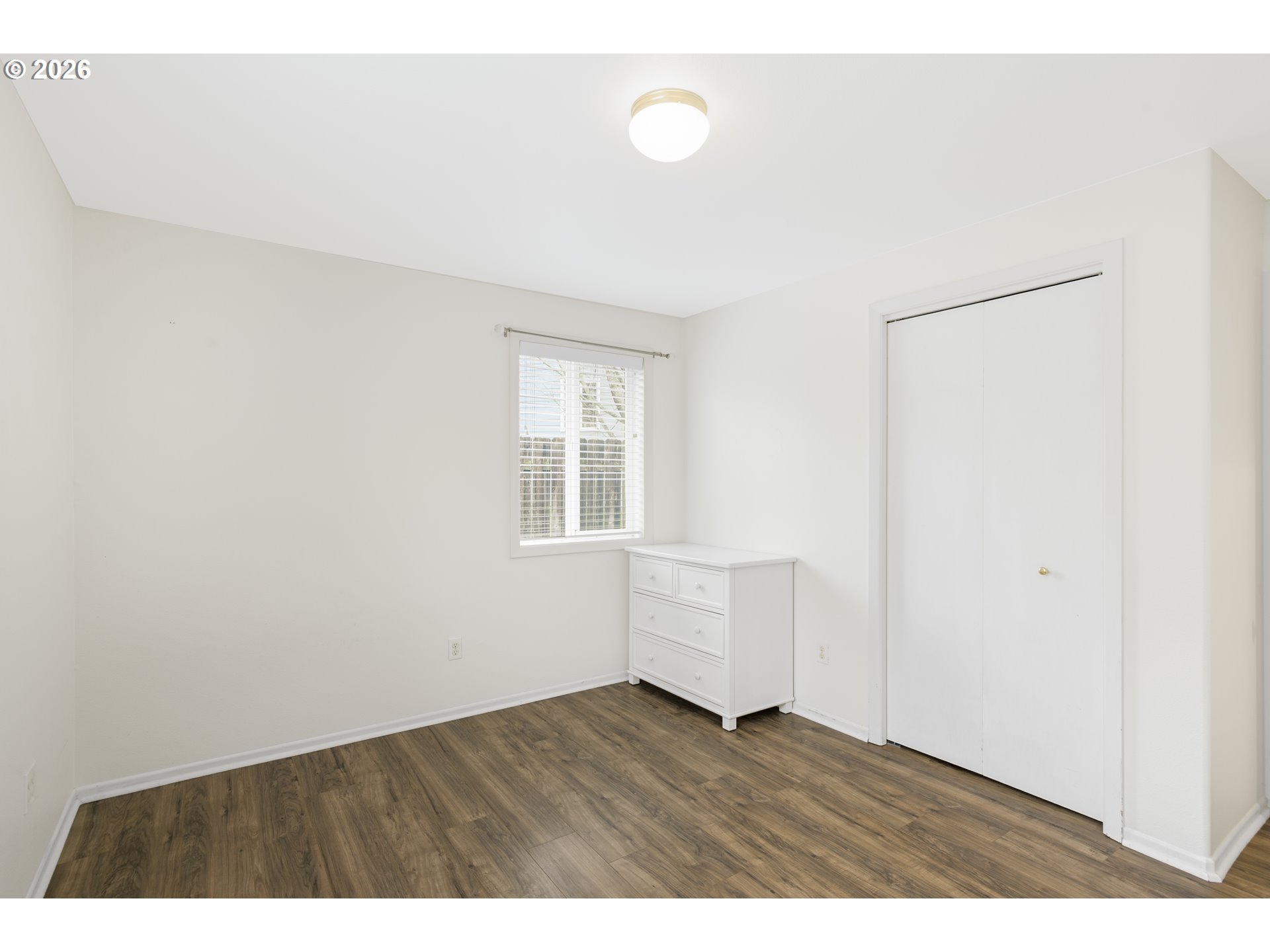 2415 Northwest Norwood Place Camas, WA 98607 - Photo 25 of 36 a view of an empty room with wooden floor and a window
