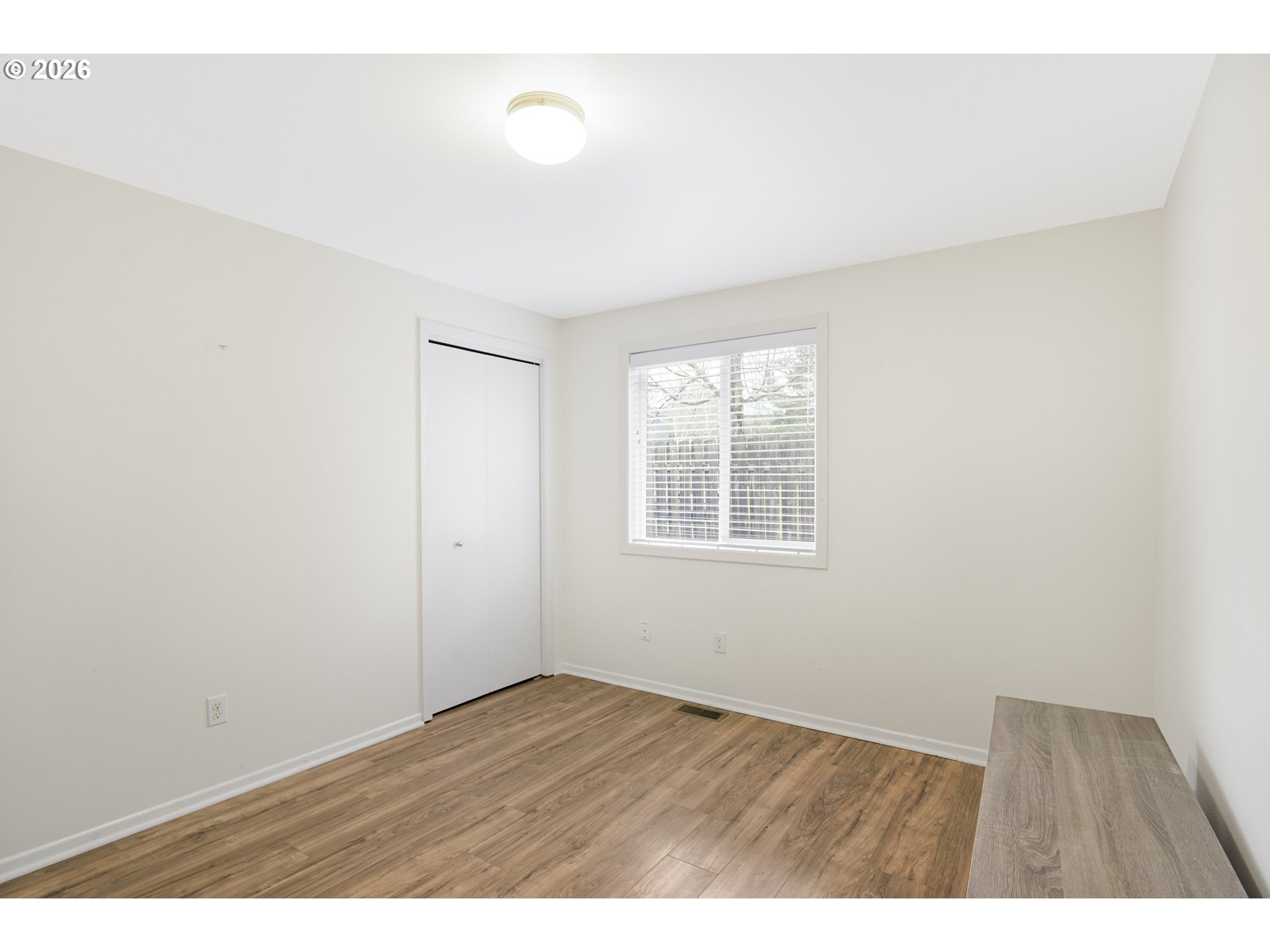 2415 Northwest Norwood Place Camas, WA 98607 - Photo 27 of 36 an empty room with wooden floor and windows
