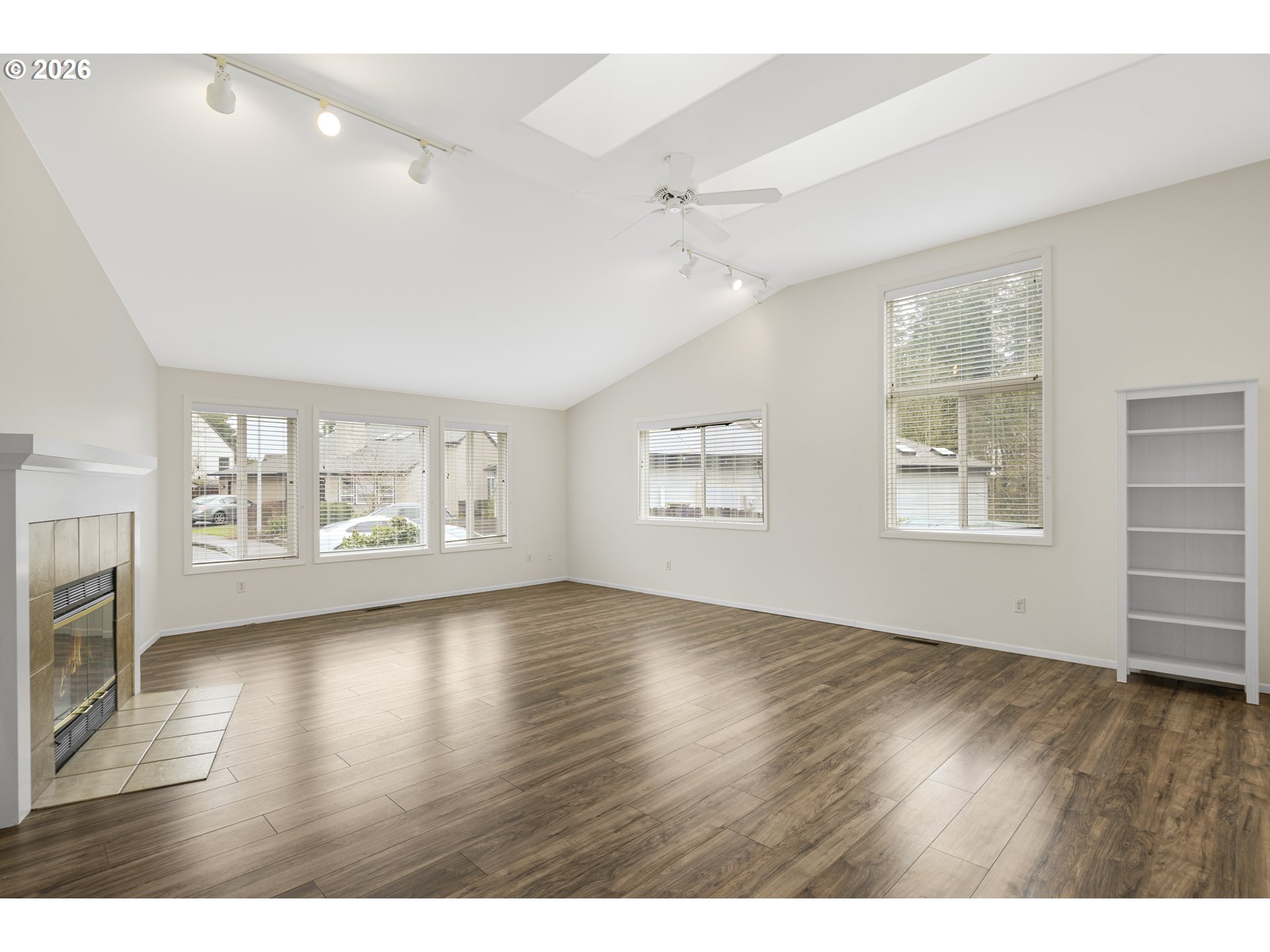 2415 Northwest Norwood Place Camas, WA 98607 - Photo 4 of 36 a view of an empty room with a window and wooden floor