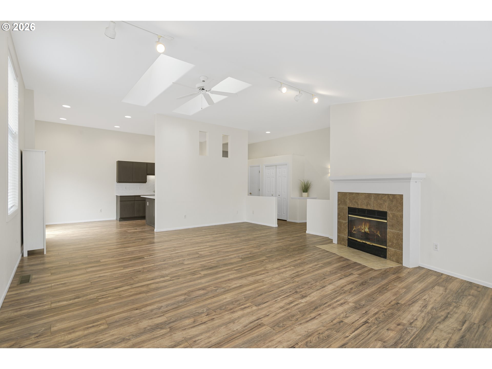 2415 Northwest Norwood Place Camas, WA 98607 - Photo 7 of 36 a view of empty room with wooden floor and fireplace