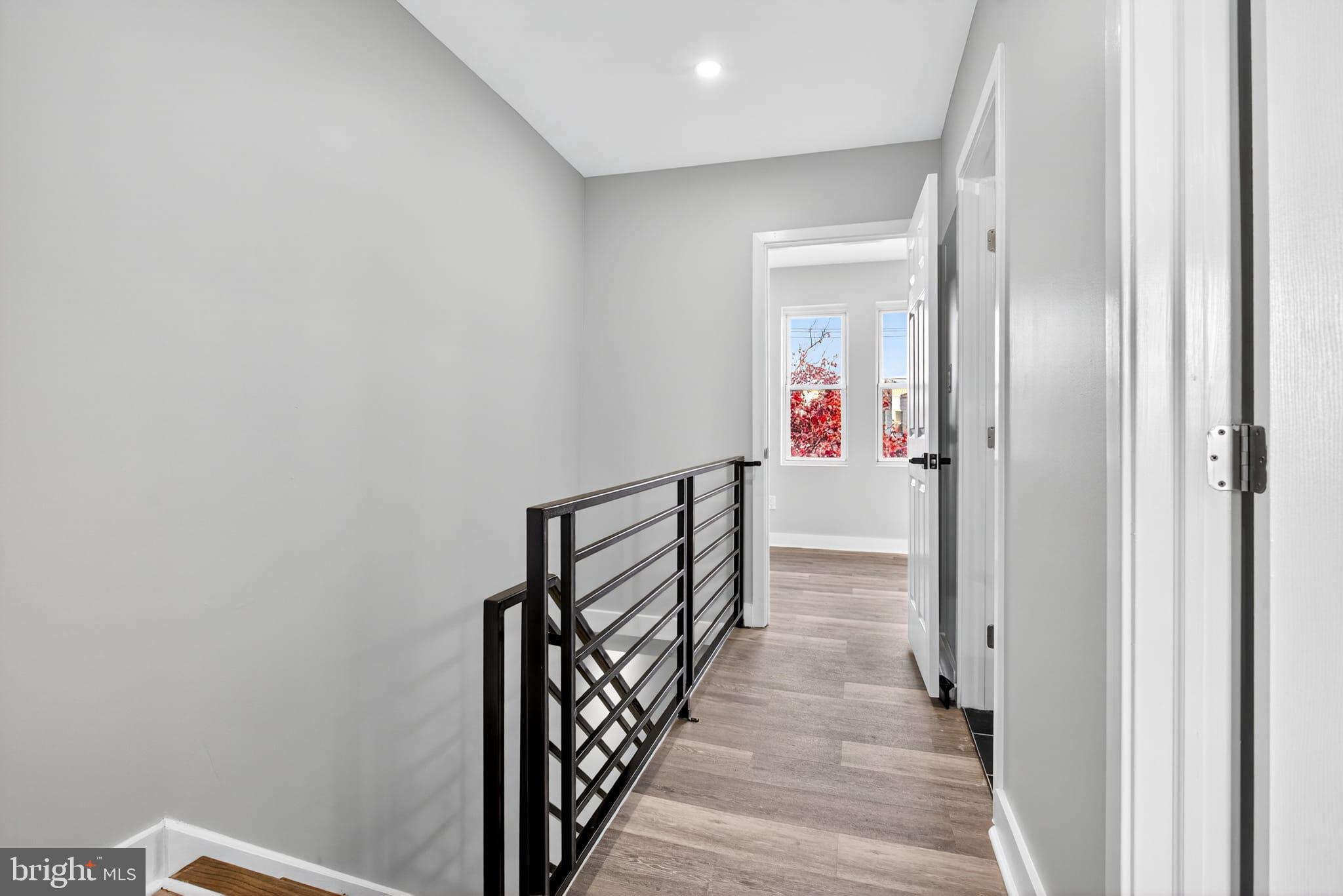 2658 South 68th Street Philadelphia, PA 19142 - Photo 13 of 36 a view of a hallway with wooden floor