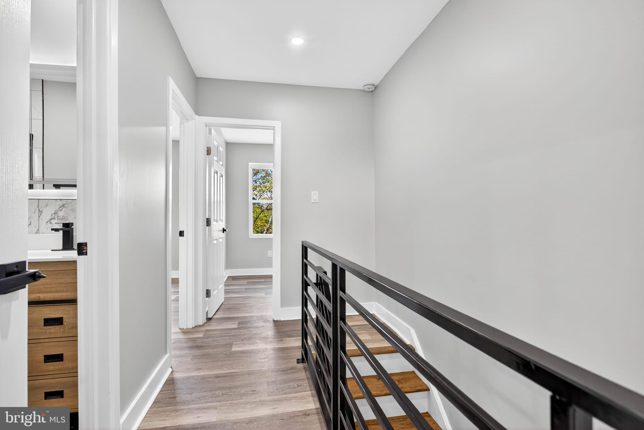 2658 South 68th Street Philadelphia, PA 19142 - Photo 14 of 36 a view of a hallway with wooden floor and staircase
