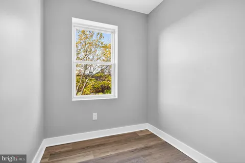 a view of room with window and closet