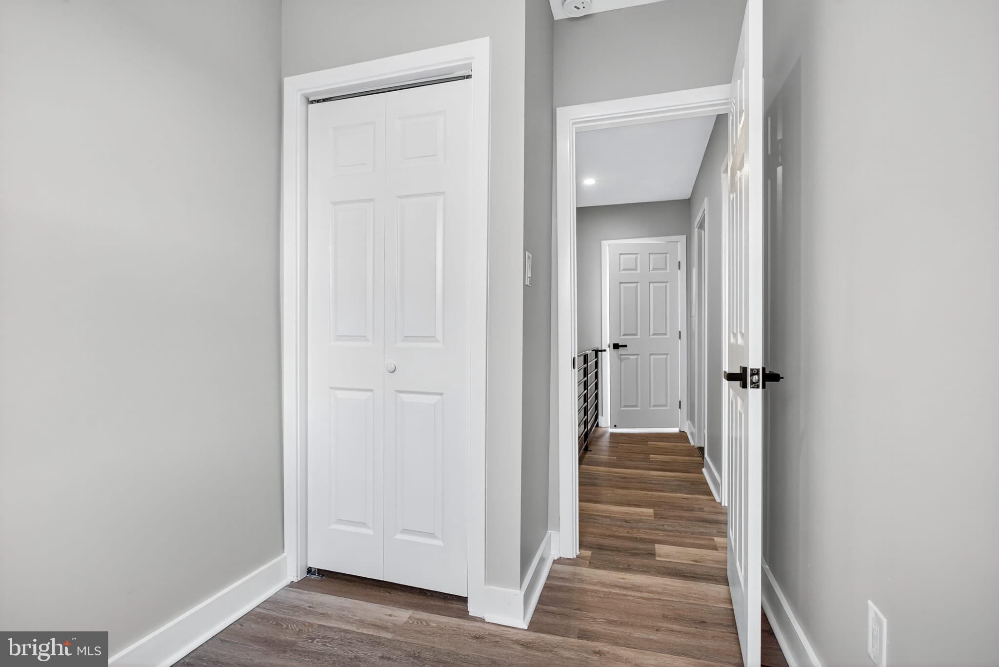 2658 South 68th Street Philadelphia, PA 19142 - Photo 20 of 36 a view of a hallway with wooden floor and closet