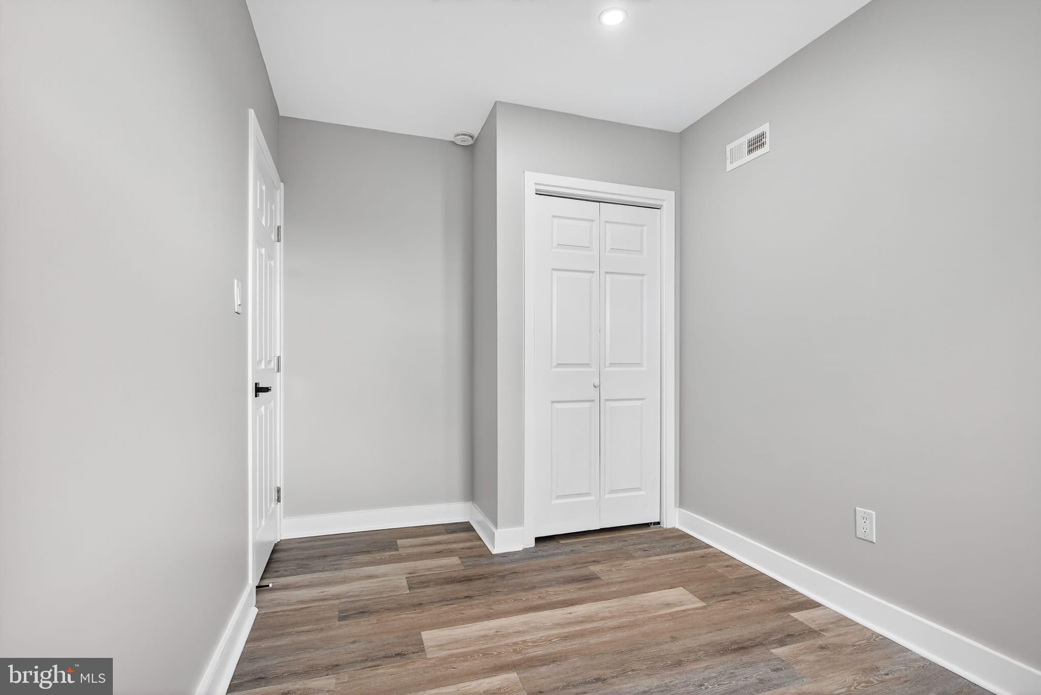 2658 South 68th Street Philadelphia, PA 19142 - Photo 22 of 36 a view of an empty room with wooden floor