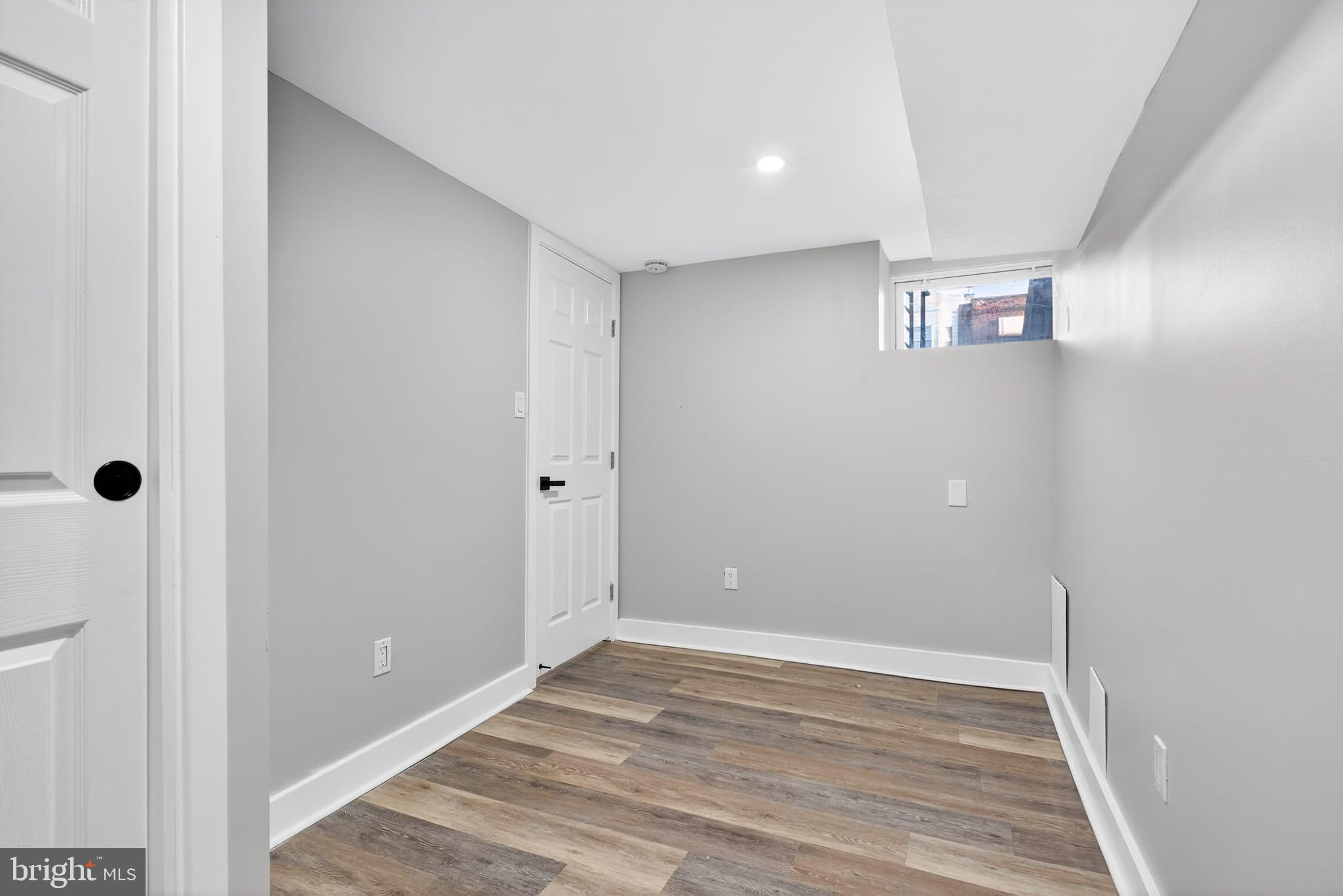 2658 South 68th Street Philadelphia, PA 19142 - Photo 27 of 36 a view of a big room with wooden floor and windows