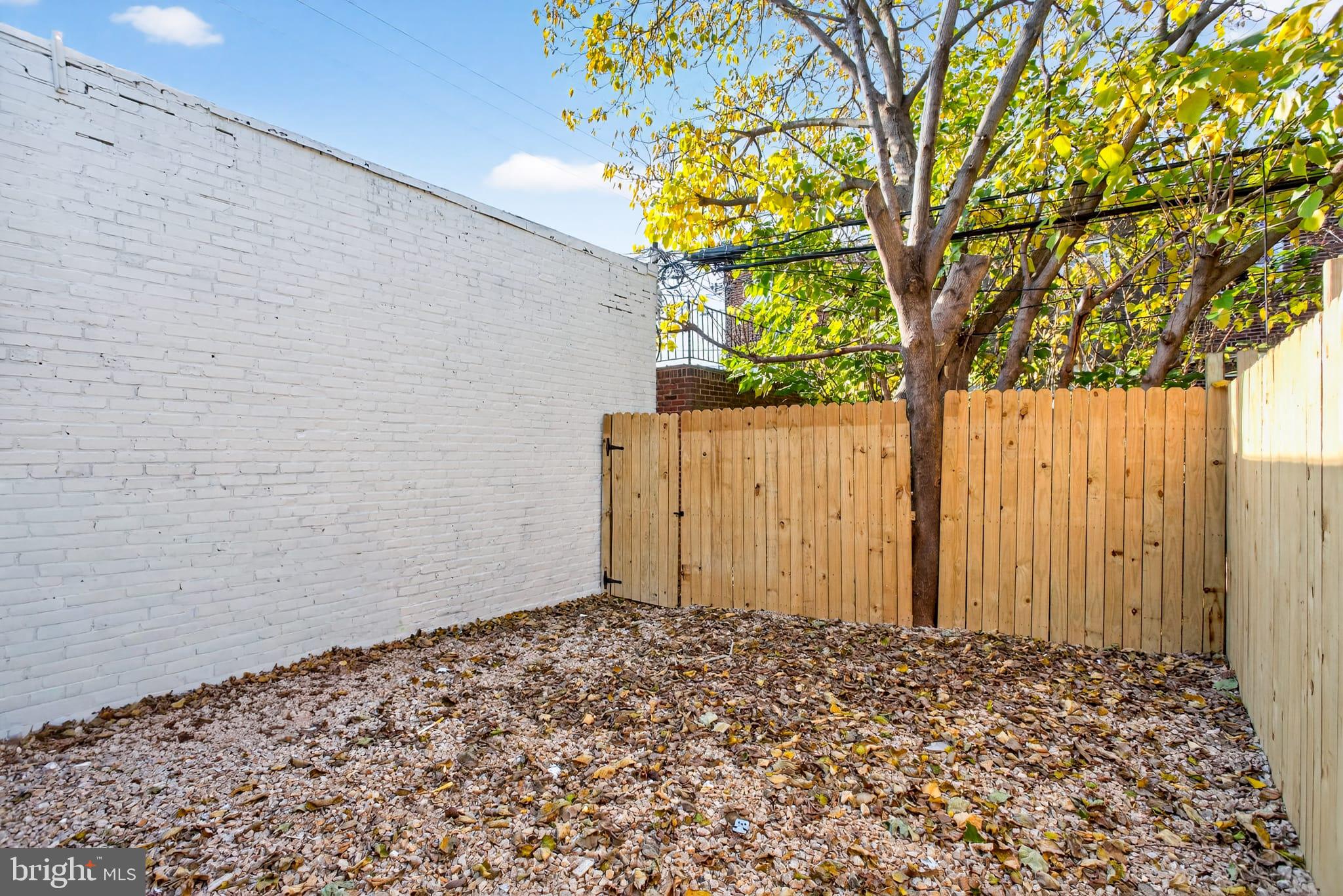 2658 South 68th Street Philadelphia, PA 19142 - Photo 33 of 36 a couple of flower plants in front of door