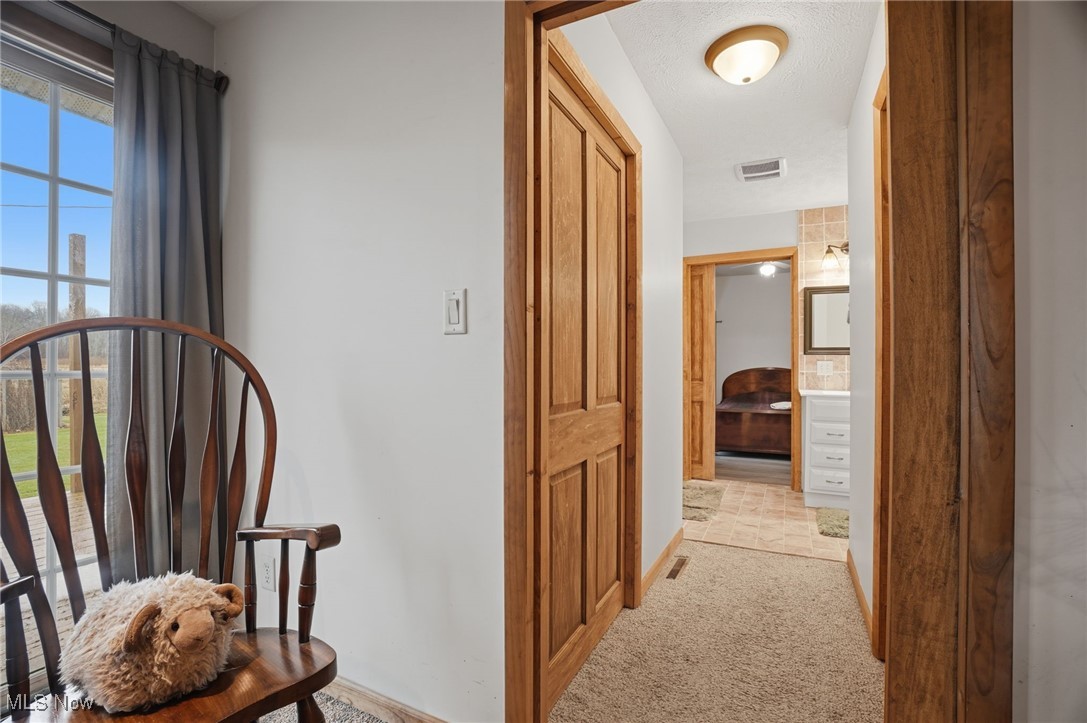 2146 Clay Road Dorset, OH 44032 - Photo 21 of 40 Corridor featuring light carpet