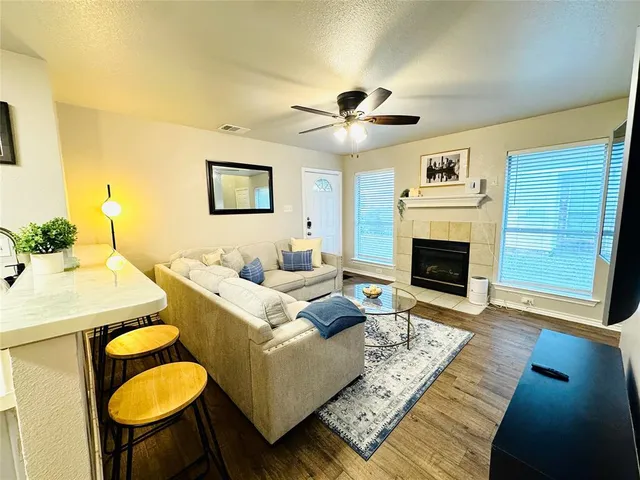a living room with furniture and a fireplace