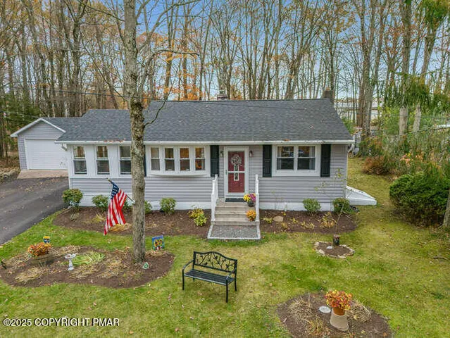 a front view of a house with garden