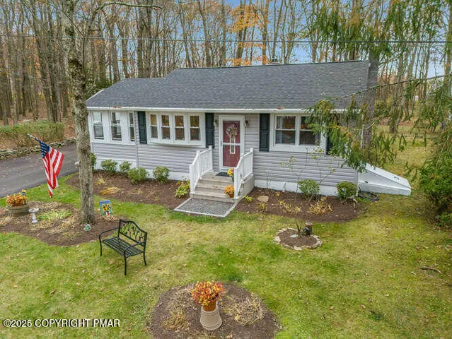 a view of house with swimming pool outdoor seating
