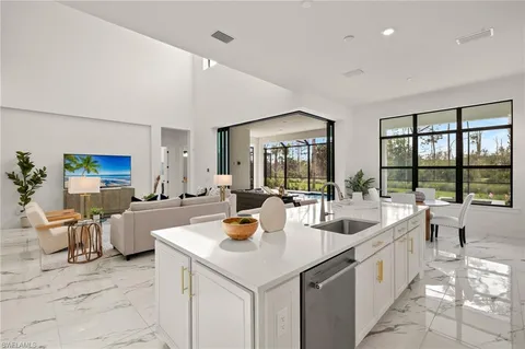a view of a kitchen with kitchen island a large window in it