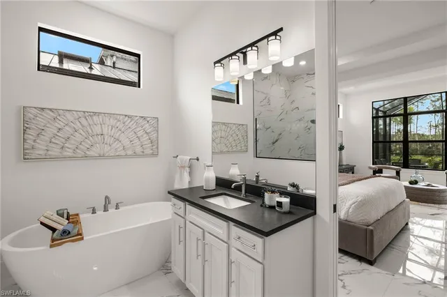 a bath room with a sink and a mirror