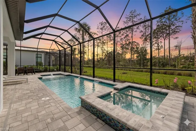 a view of swimming pool with a patio