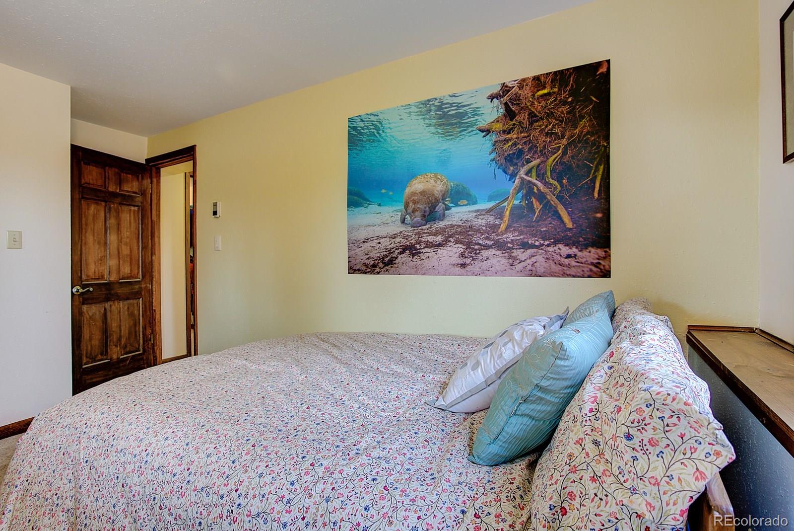 1983 Ridge Road Nederland, CO 80466 - Photo 22 of 30 a view of a bed in a bedroom