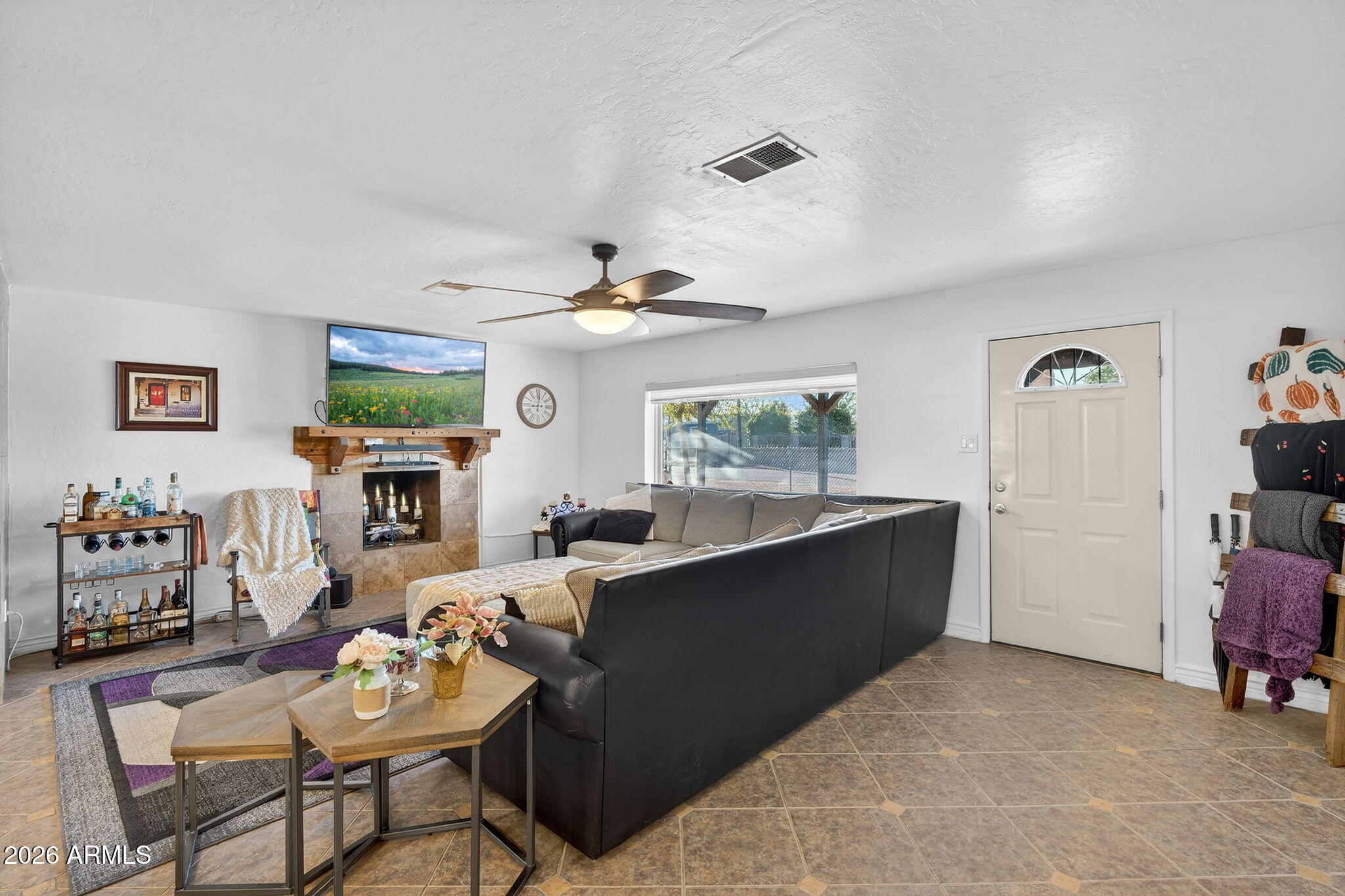 13202 West Ocotillo Road Glendale, AZ 85307 - Photo 12 of 58 a living room with furniture and a large window