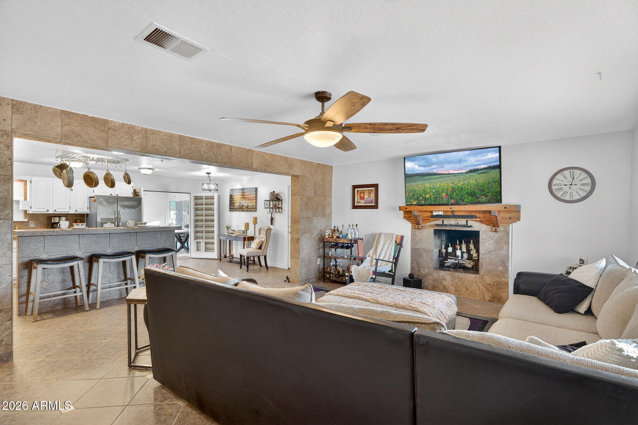 13202 West Ocotillo Road Glendale, AZ 85307 - Photo 13 of 58 a living room with fireplace furniture and a large window