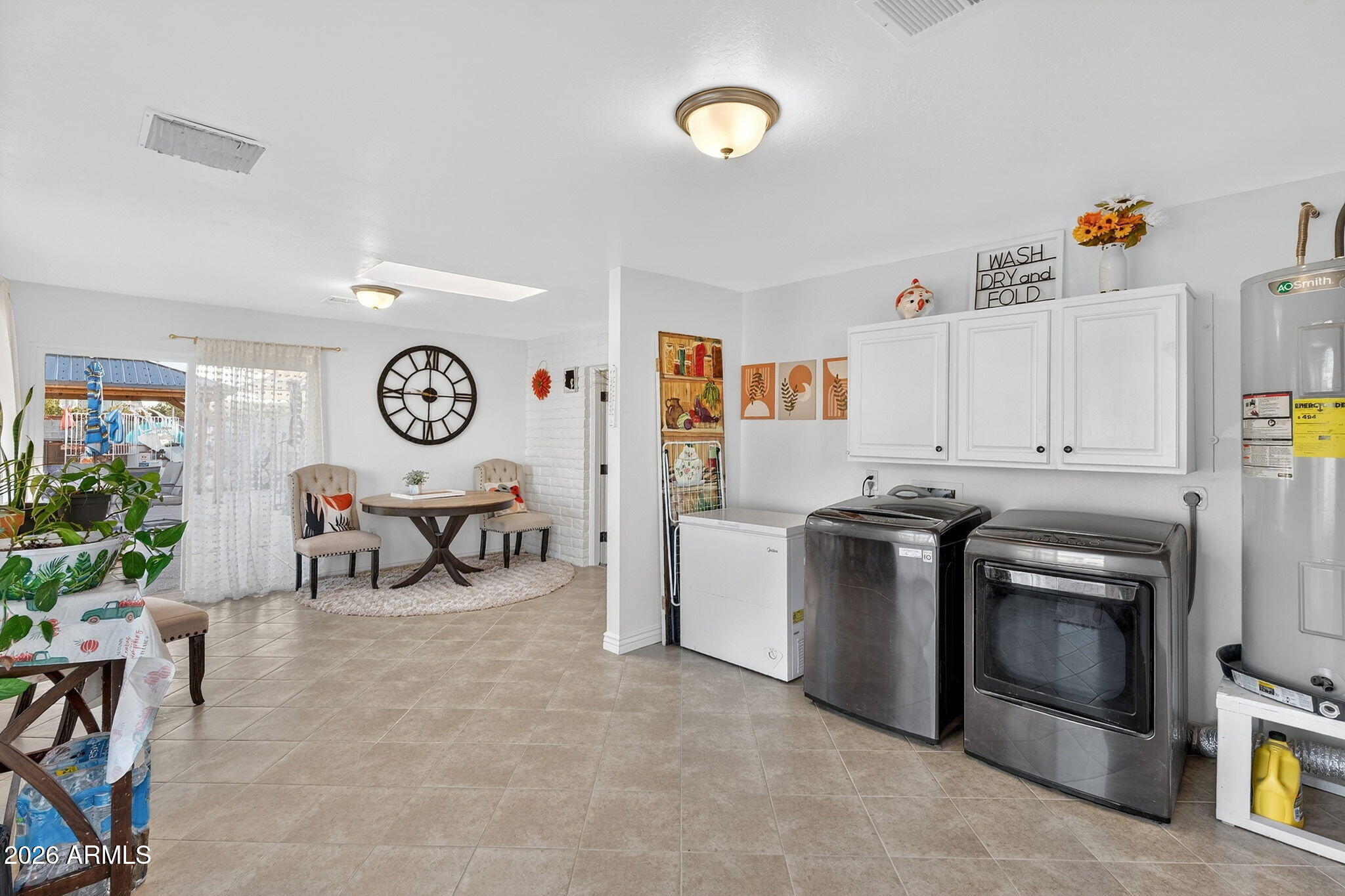 13202 West Ocotillo Road Glendale, AZ 85307 - Photo 20 of 58 a kitchen with stainless steel appliances and white cabinets