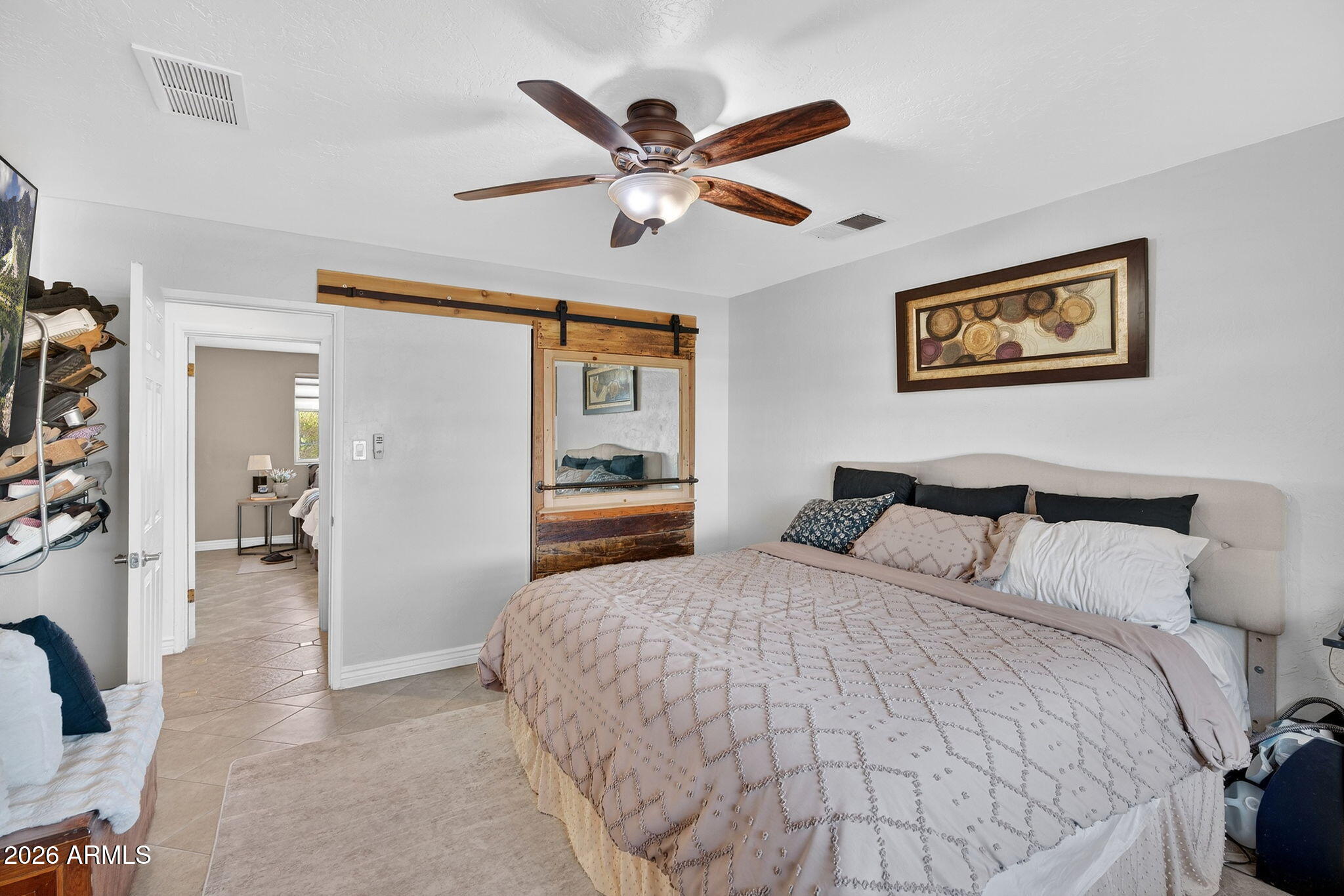 13202 West Ocotillo Road Glendale, AZ 85307 - Photo 21 of 58 a bedroom with a bed and a ceiling fan