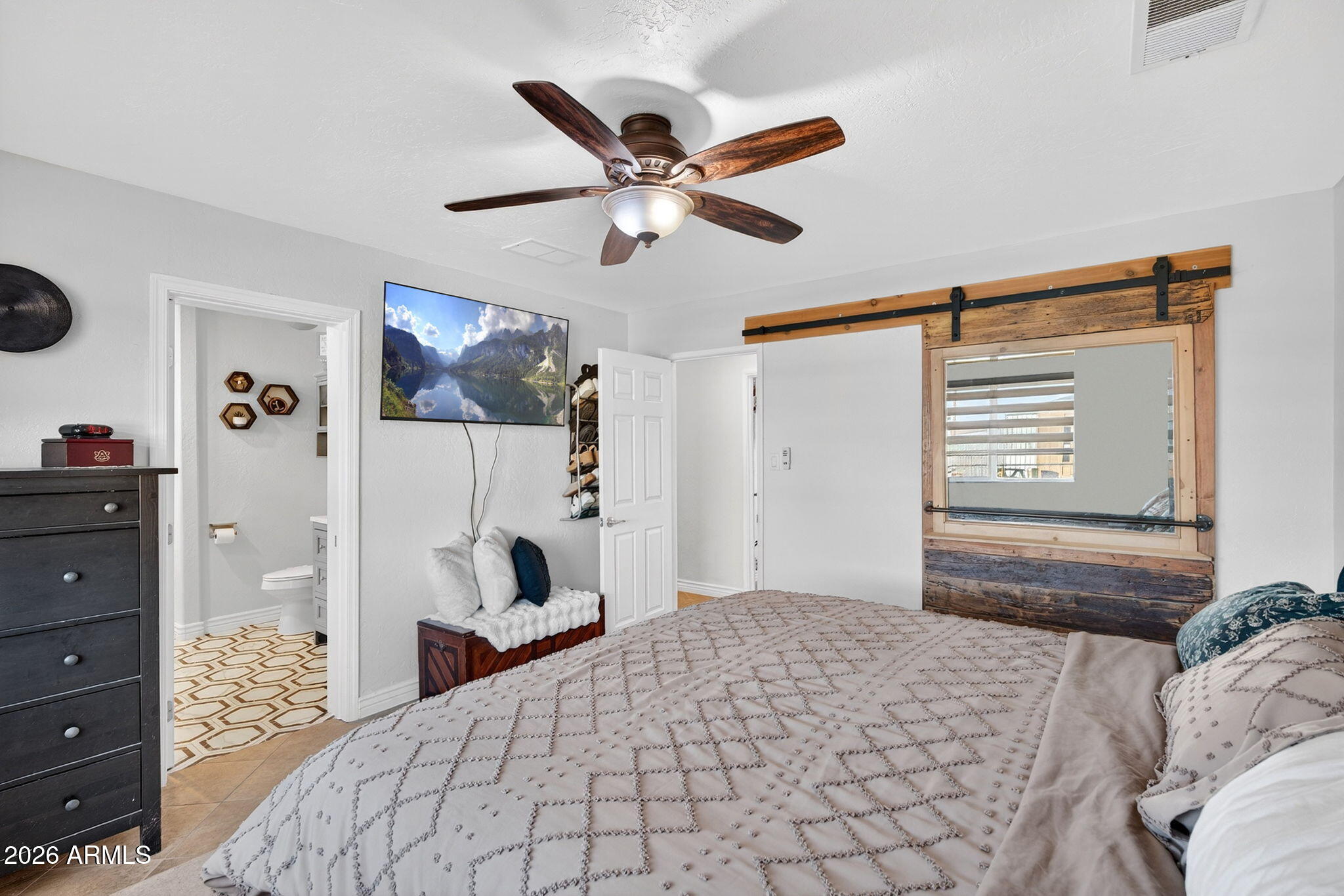 13202 West Ocotillo Road Glendale, AZ 85307 - Photo 23 of 58 a bedroom with a bed and a cabinets