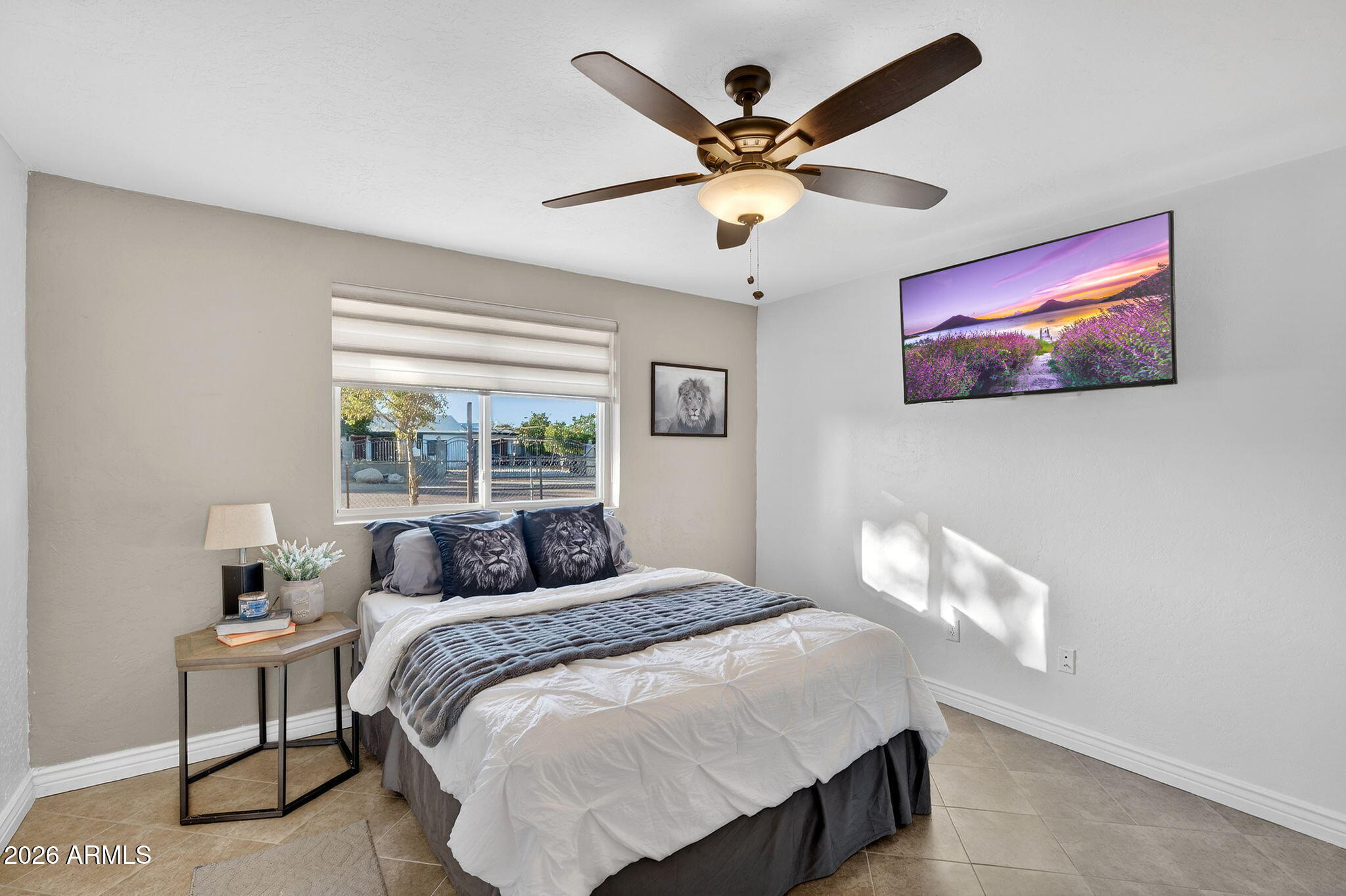 13202 West Ocotillo Road Glendale, AZ 85307 - Photo 29 of 58 a bedroom with a large bed and a window