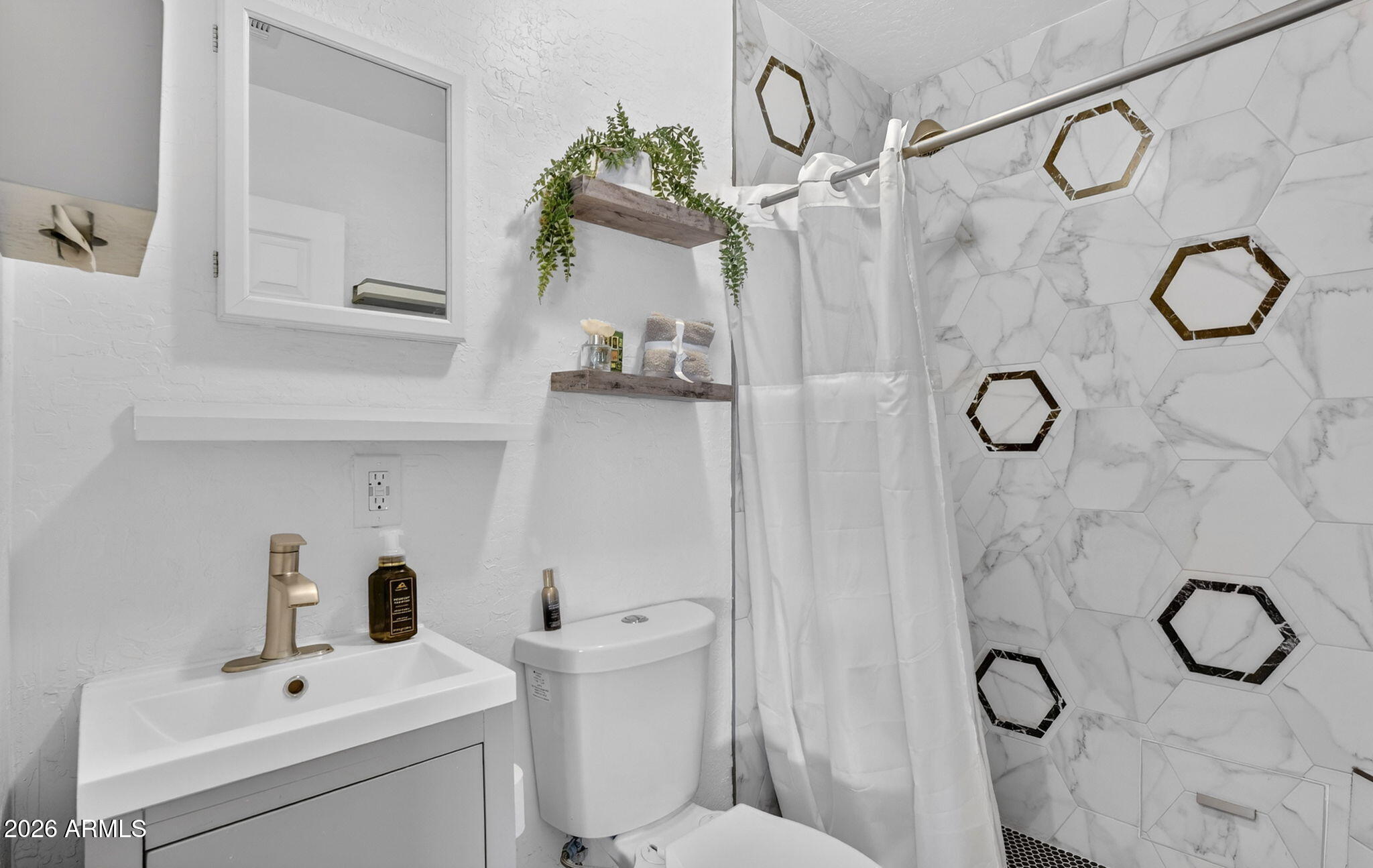 13202 West Ocotillo Road Glendale, AZ 85307 - Photo 30 of 58 a bathroom with a granite countertop sink a toilet and shower