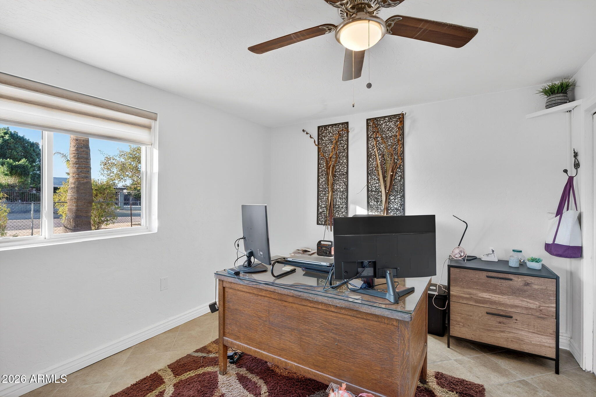 13202 West Ocotillo Road Glendale, AZ 85307 - Photo 31 of 58 a view of a workspace with furniture and a window