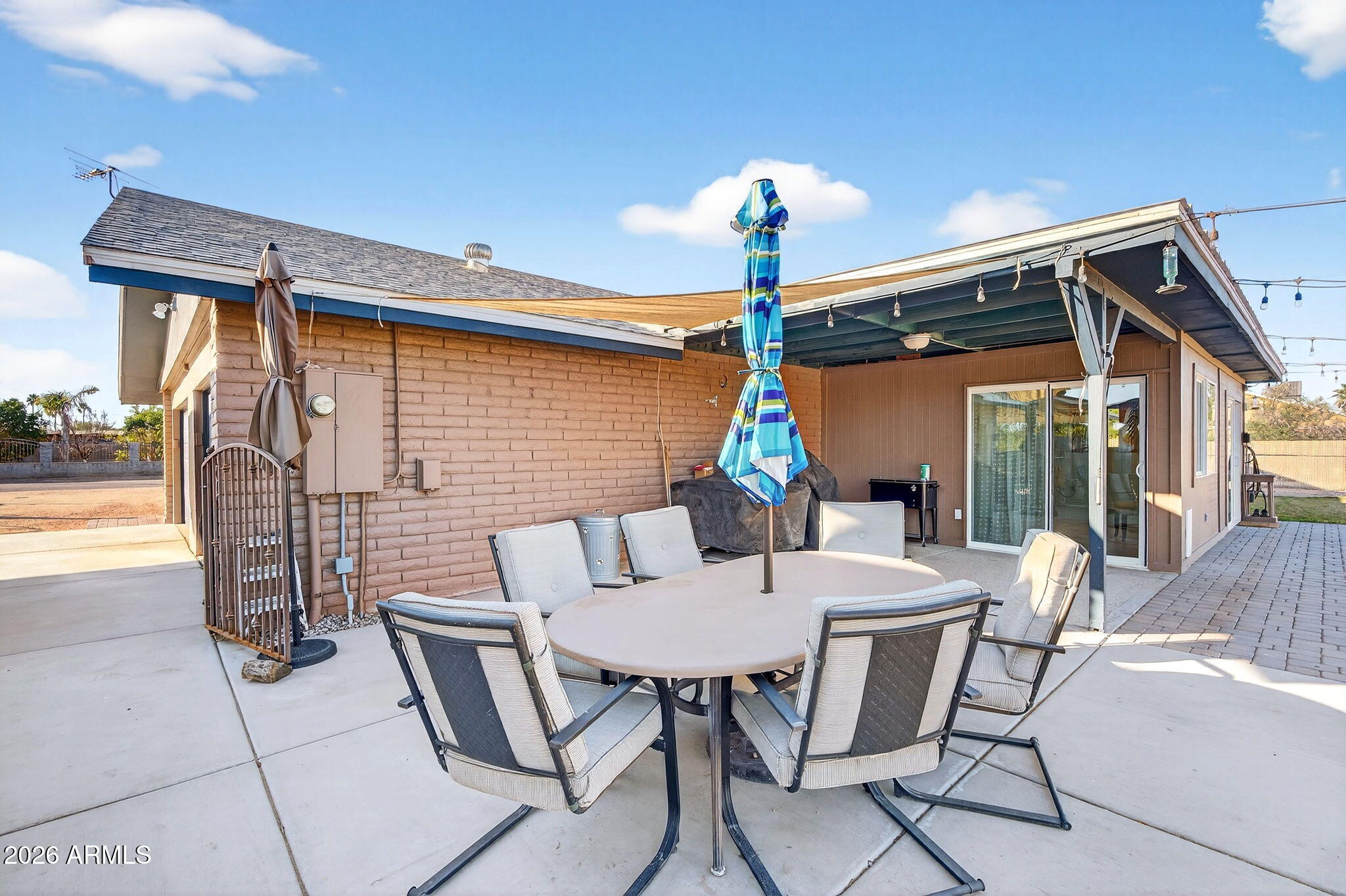 13202 West Ocotillo Road Glendale, AZ 85307 - Photo 37 of 58 a table and chairs in patio of the house