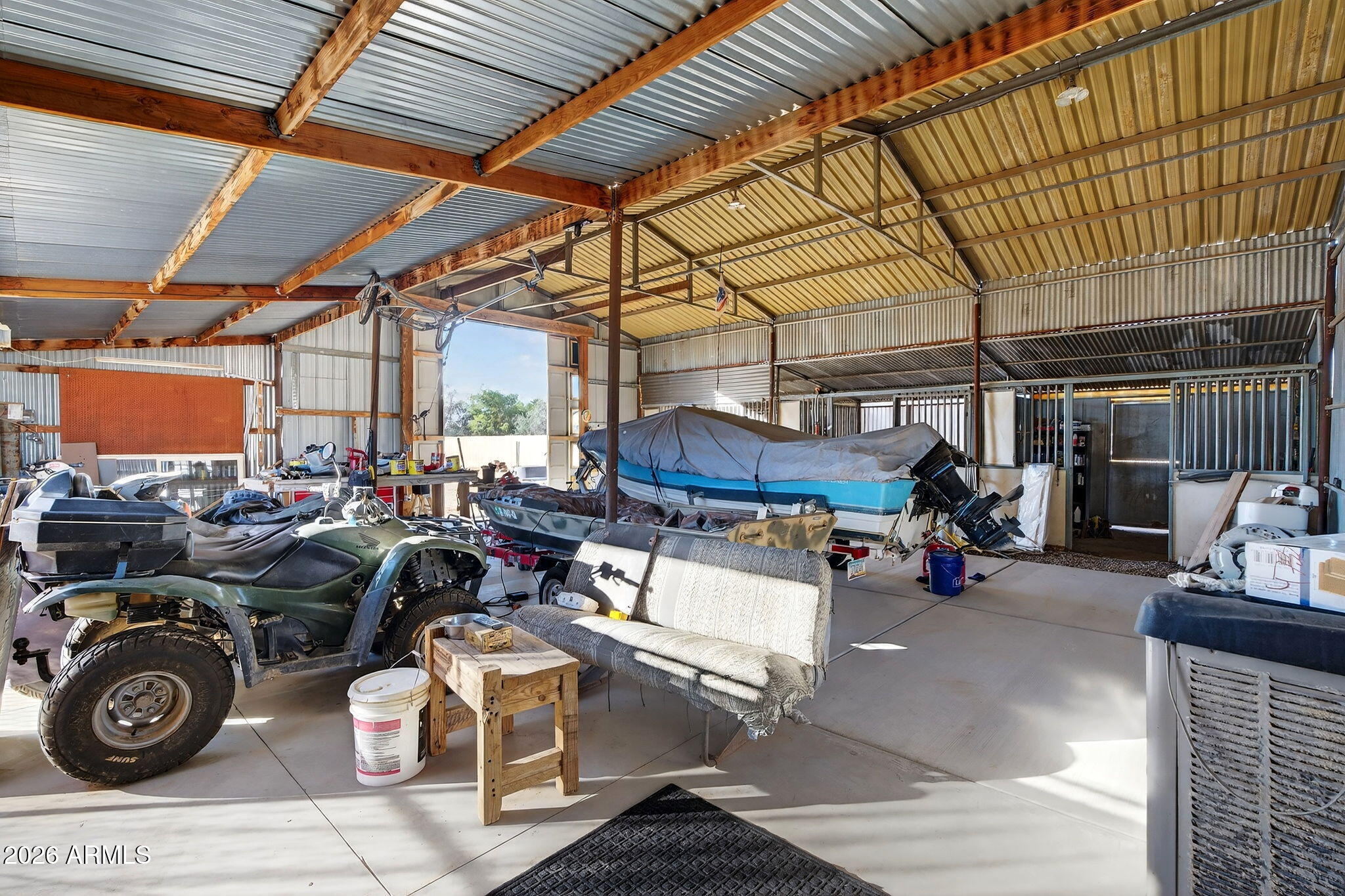 13202 West Ocotillo Road Glendale, AZ 85307 - Photo 40 of 58 a view of a garage with a bike and wooden roof