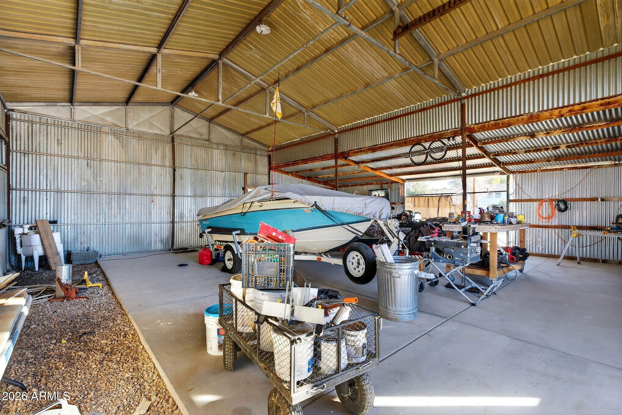 13202 West Ocotillo Road Glendale, AZ 85307 - Photo 42 of 58 a view of a garage with a table and chairs