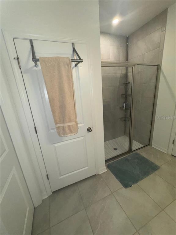 4356 Reisswood Loop Palmetto, FL 34221 - Photo 11 of 17 a bathroom with a shower and a mirror