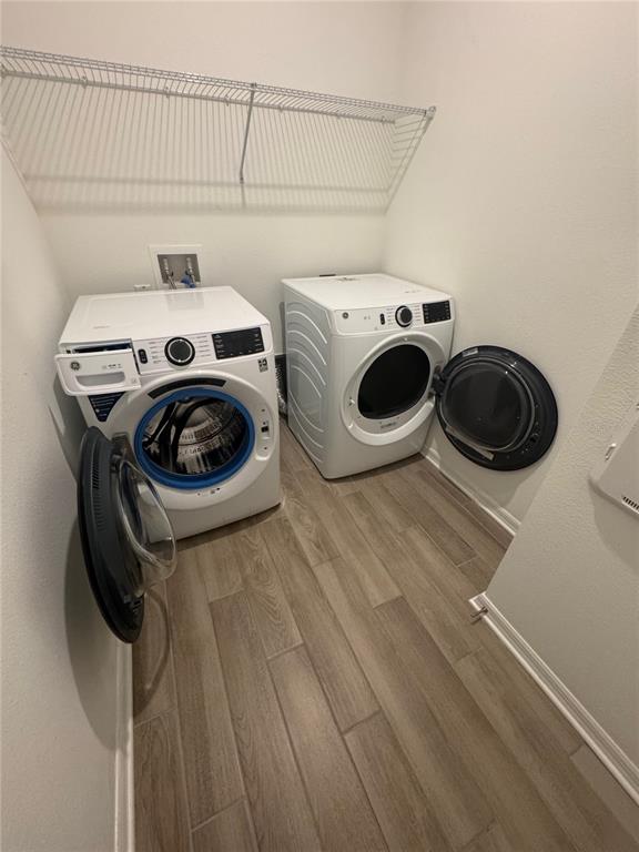 4356 Reisswood Loop Palmetto, FL 34221 - Photo 15 of 17 a utility room with dryer and washer