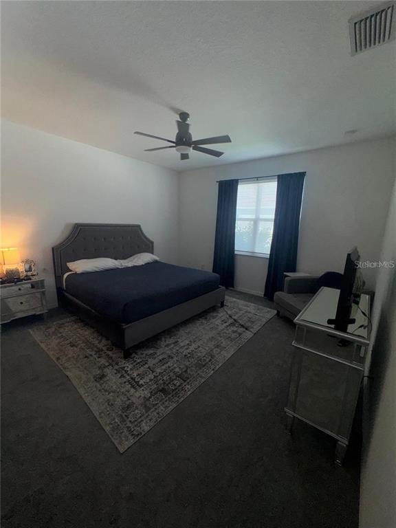 4356 Reisswood Loop Palmetto, FL 34221 - Photo 9 of 17 a living room with a bed furniture and a window