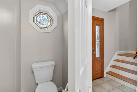 a view of a room with wooden floor and white walls