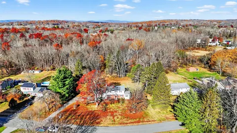 a brick building with a yard