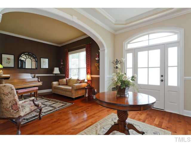 4004 Fenn Brook Lane Raleigh, NC 27613 - Photo 6 of 25 Gorgeous entryway to welcome guests with trey ceilings . Unbelievable Living space with chair moldings and glowing hardwoods. Foyer