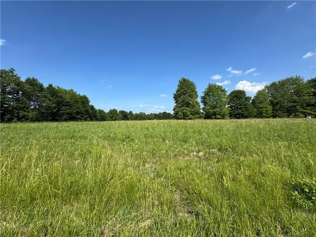 a view of a field with an outdoor space