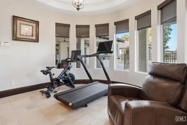 a kitchen with stainless steel appliances granite countertop a refrigerator stove and sink