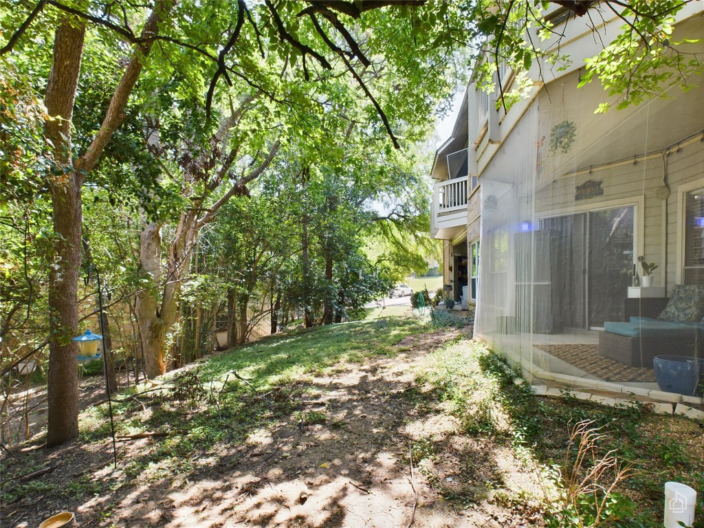 2450 Wickersham Lane, Unit 501 Austin, TX 78741 - Photo 18 of 21 a view of a yard with plants and trees