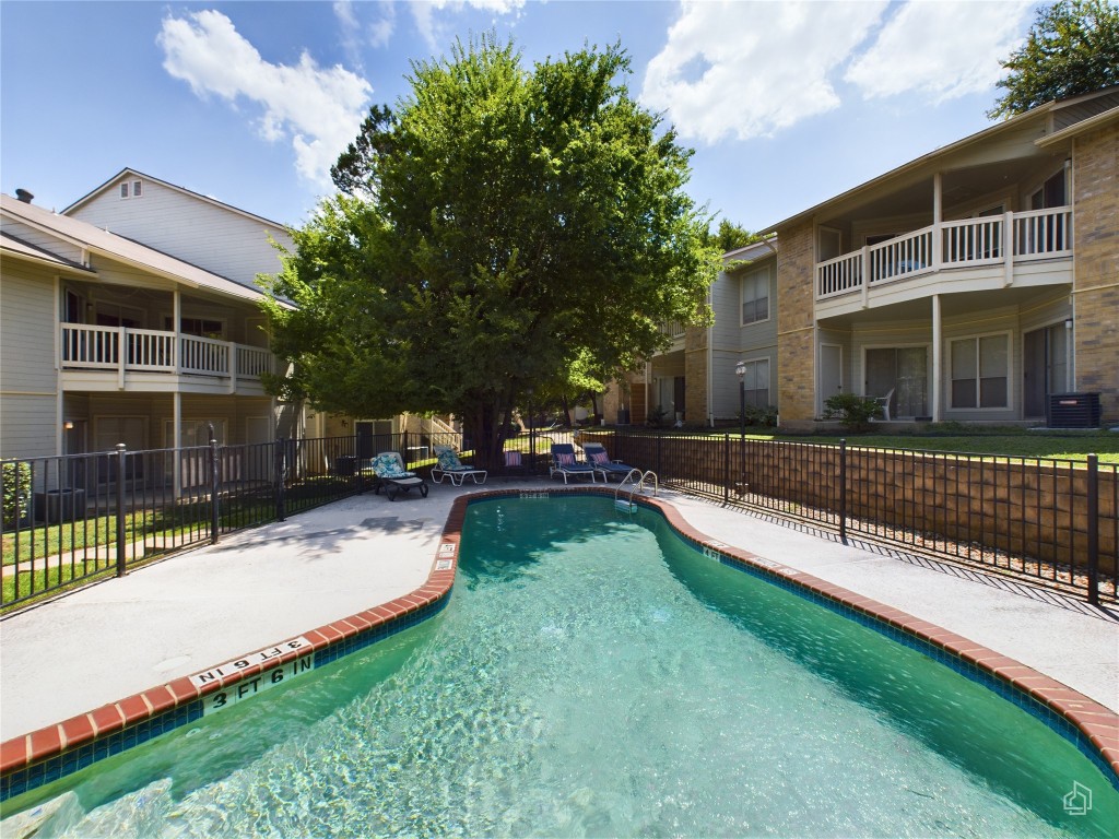 2450 Wickersham Lane, Unit 501 Austin, TX 78741 - Photo 21 of 21 a view of a house with a yard and sitting area