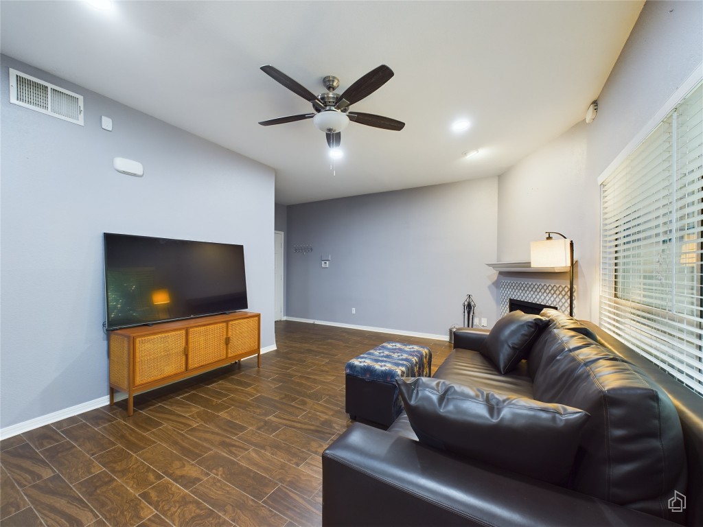 2450 Wickersham Lane, Unit 501 Austin, TX 78741 - Photo 4 of 21 a living room with furniture and a flat screen tv