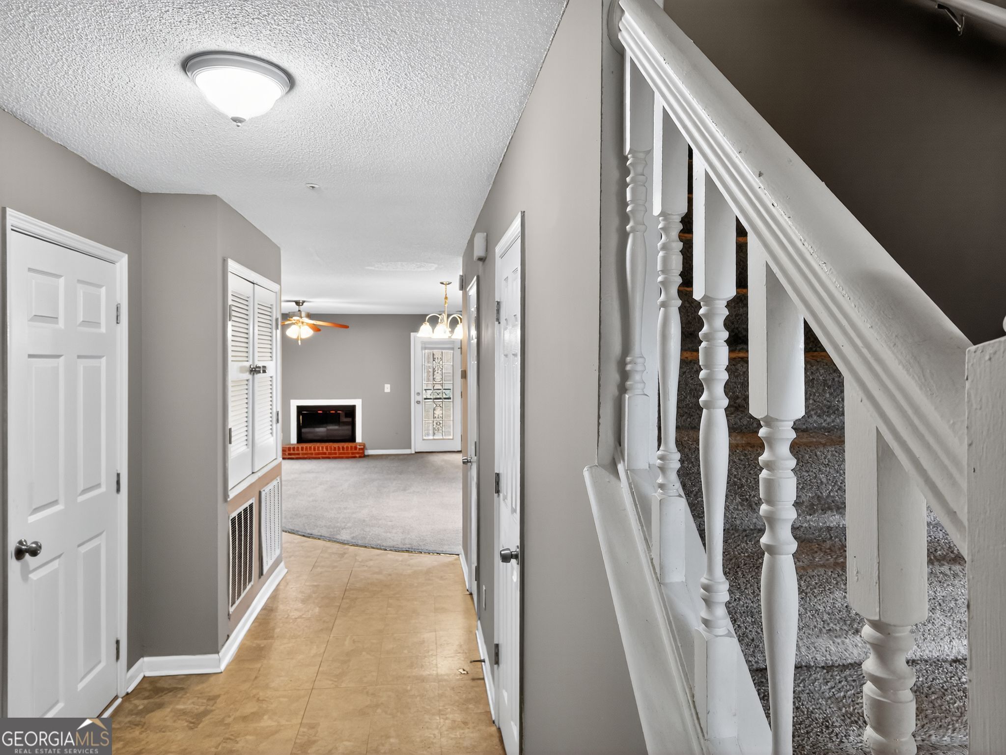 3604 Spring Trace Decatur, GA 30034 - Photo 3 of 32 a view of a hallway with wooden floor and staircase