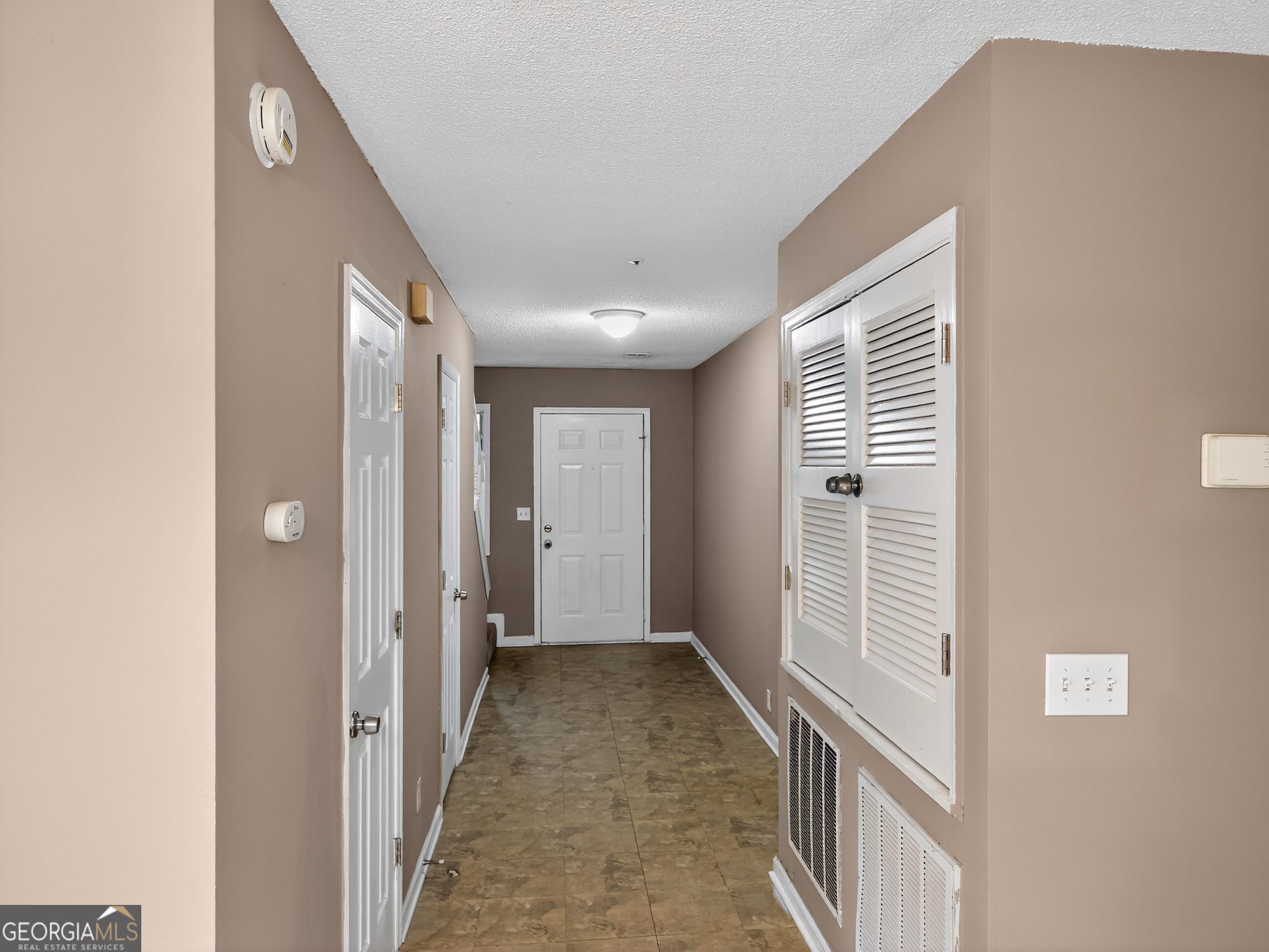 3604 Spring Trace Decatur, GA 30034 - Photo 4 of 32 a view of a hallway with wooden floor and a bathroom