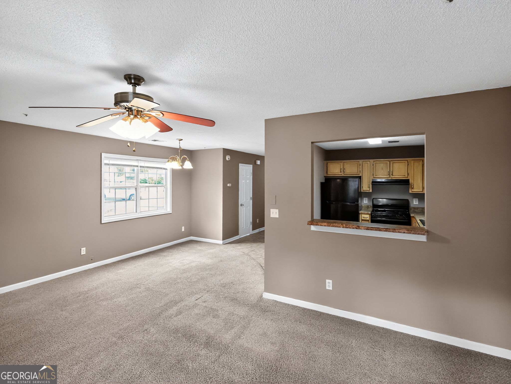 3604 Spring Trace Decatur, GA 30034 - Photo 8 of 32 a view of a livingroom with an empty space and a window