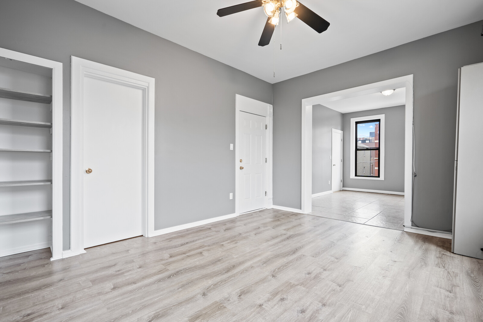 1331 West Huron Street Chicago, IL 60642 - Photo 2 of 11 a view of an empty room with a window and wooden floor