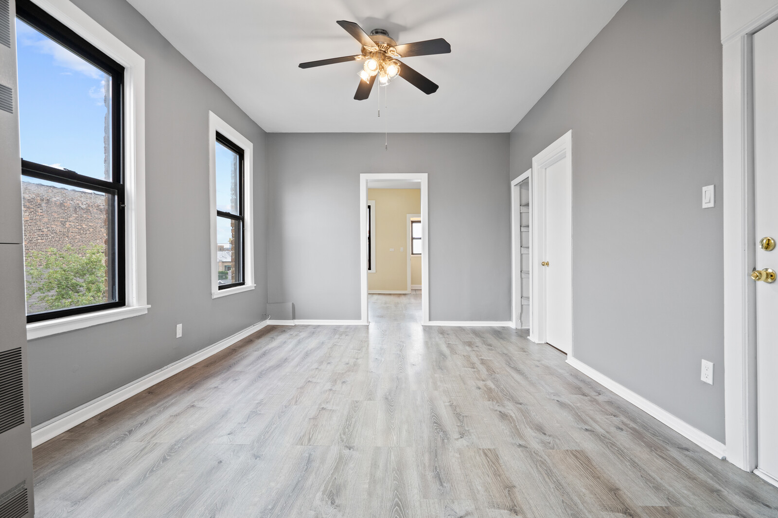 1331 West Huron Street Chicago, IL 60642 - Photo 3 of 11 wooden floor in an empty room with a window